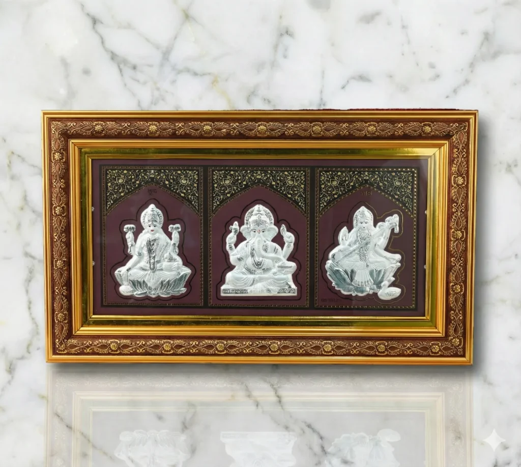 Lakshmi, Ganesha and Saraswati silver frame on marble